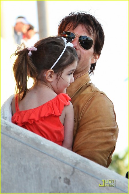 Actor Tom Cruise and daughter Suri Cruise attend Super Bowl XLIV at the Sun Life Stadium on February 7, 2010 in Miami Gardens, Florida.